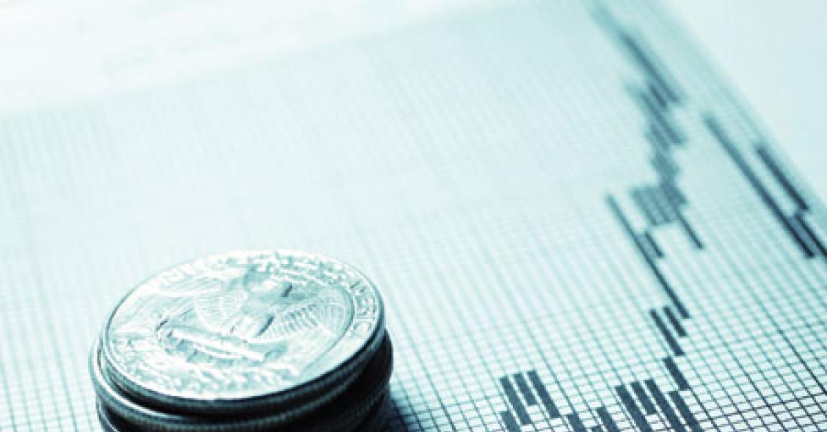 000015324141 quarters on stock market sheet web