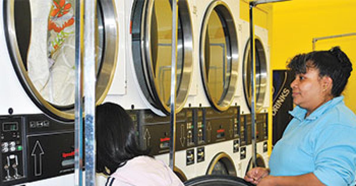 Calvary Laundromat family doing laundry