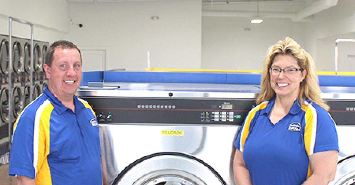 Sharon Brinks and husband Steve pose inside The Laundry Station
