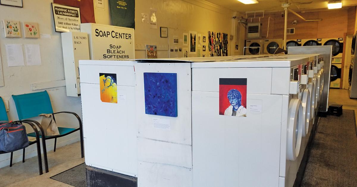 Masonic Street Laundry interior with art