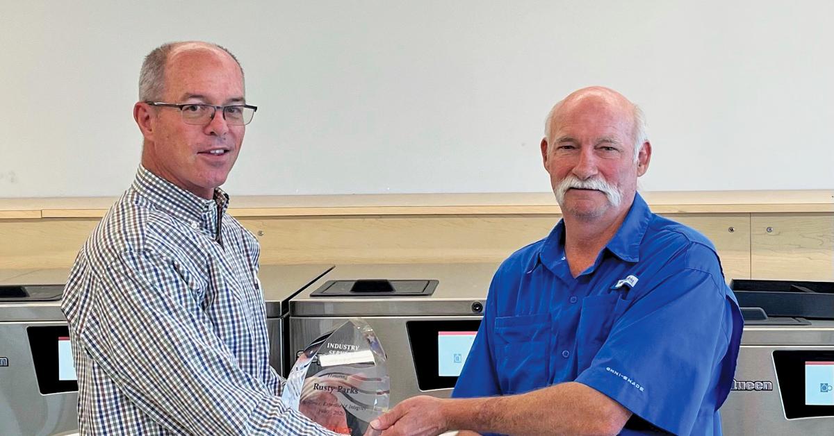 SLE Presents Industry Service Award to Parks