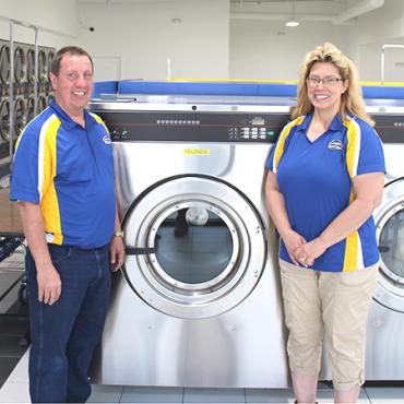 Sharon Brinks and husband Steve pose inside The Laundry Station